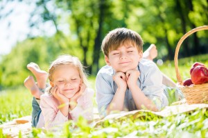 kids in the grass with eyes closed